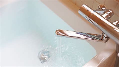 Water Leaking from Under the Bathtub: Possible Causes and